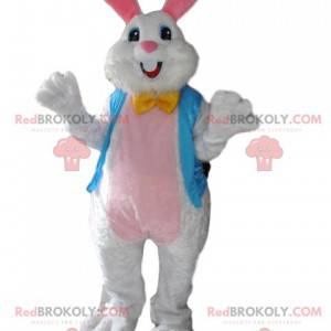 Jedwabisty biały królik maskotka z jego błękitną kamizelką -