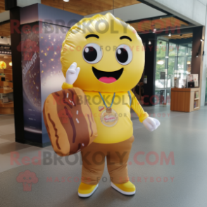 Gold Donut mascot costume character dressed with a Button-Up Shirt and Tote bags