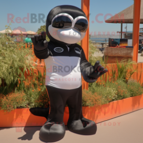 Rust Killer Whale mascot costume character dressed with a Rash Guard and Sunglasses