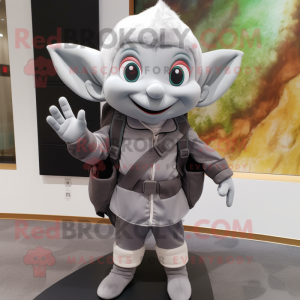 Gray Elf mascot costume character dressed with a Vest and Backpacks