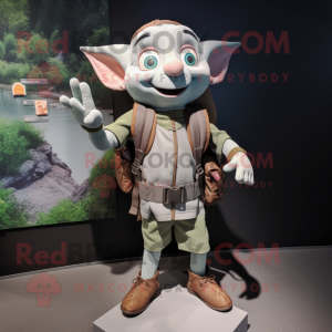 Gray Elf mascot costume character dressed with a Vest and Backpacks