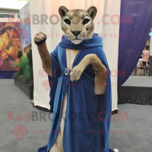 Blue Mountain Lion mascot costume character dressed with a Empire Waist Dress and Wraps