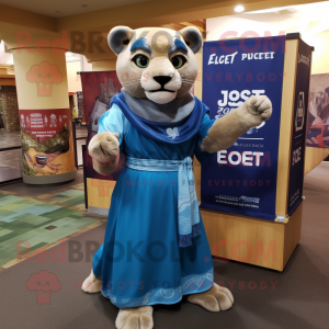 Blue Mountain Lion mascot costume character dressed with a Empire Waist Dress and Wraps