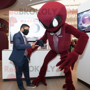 Maroon Spider mascot costume character dressed with a Blazer and Watches