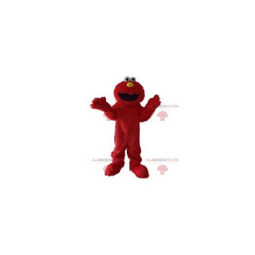 Mascota del monstruo rojo peludo divertido y sonriente -