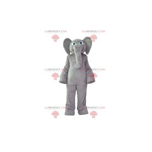 Mascota elefante gris con un abrigo suave y una gran sonrisa -
