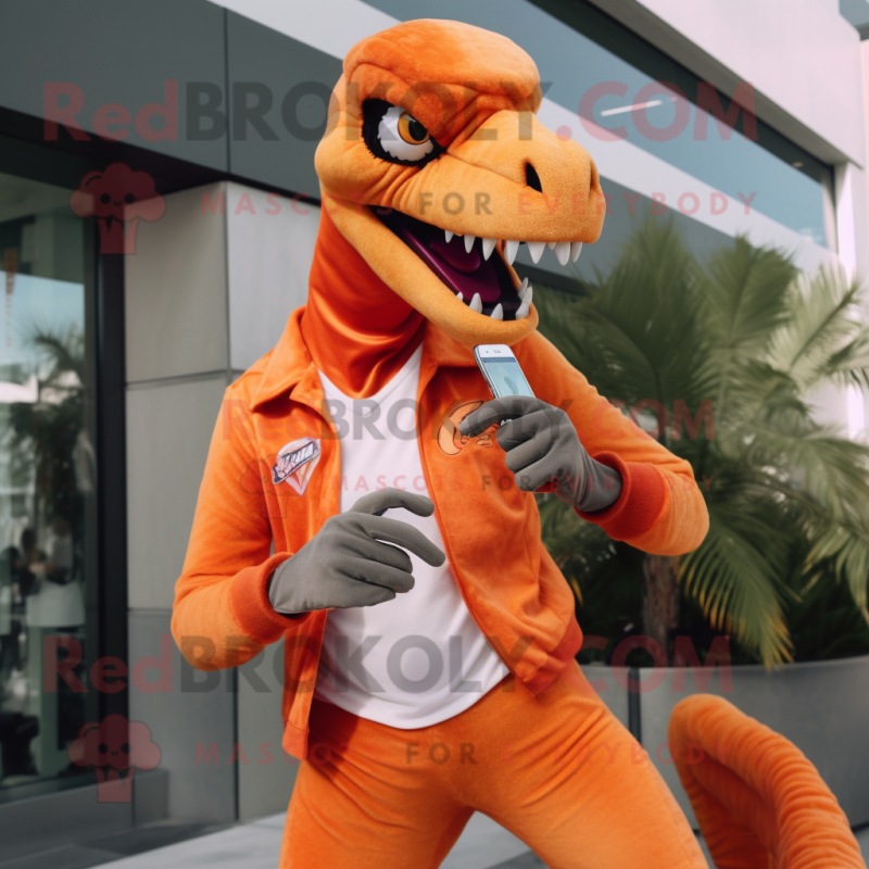 Orange Velociraptor mascot costume character dressed with a Capri Pants and  Smartwatches - Mascot Costumes -  Sizes L (175-180CM)