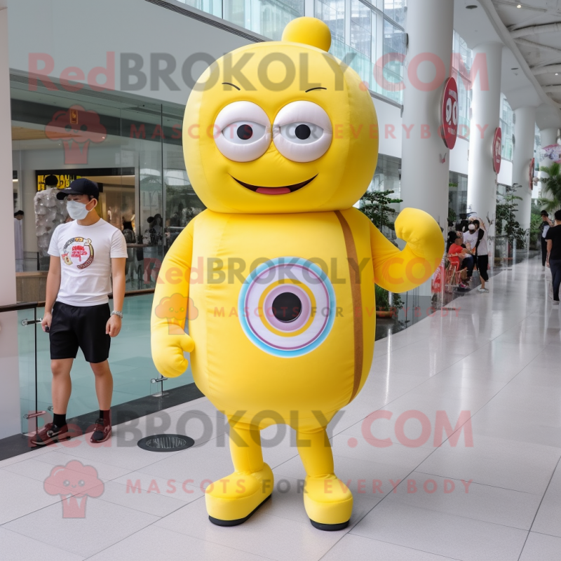 Lemon Yellow Donut mascot costume character dressed with a Polo Shirt and Bracelet watches