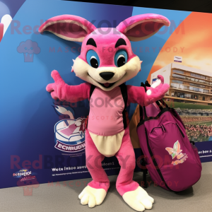 Pink Chupacabra mascot costume character dressed with a Board Shorts and Tote bags