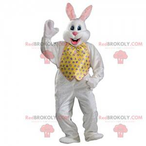 Mascota del conejo blanco con su chaqueta y pajarita amarilla -