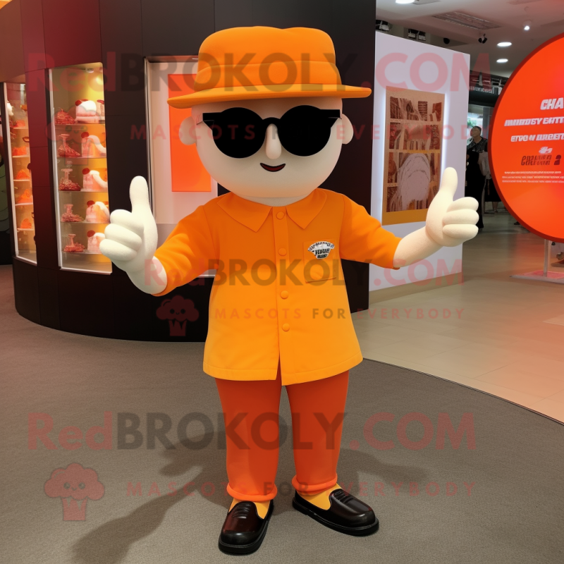 Orange Magician mascot costume character dressed with a Polo Shirt and Sunglasses