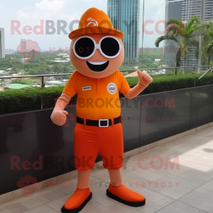 Orange Magician mascot costume character dressed with a Polo Shirt and Sunglasses