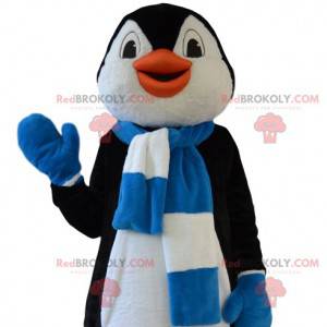 Mascota divertida del pingüino con su bufanda azul y blanca -