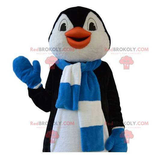 Divertente mascotte pinguino con la sua sciarpa blu e bianca -