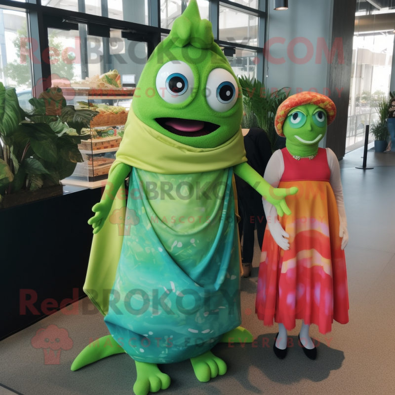Green Fish Tacos mascot costume character dressed with a Maxi Dress and Wraps Green Fish Tacos mascot costume character dressed with a Maxi Dress and Wraps