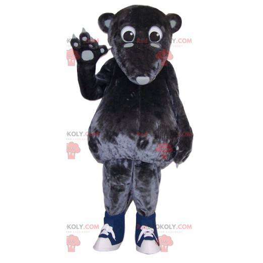 Gray marsupial mascot touching - Redbrokoly.com