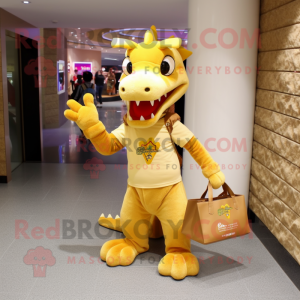 Gold Dragon mascot costume character dressed with a T-Shirt and Tote bags