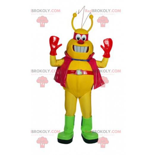 Mascotte d'insecte jaune avec sa cape et son bandeau rouges -