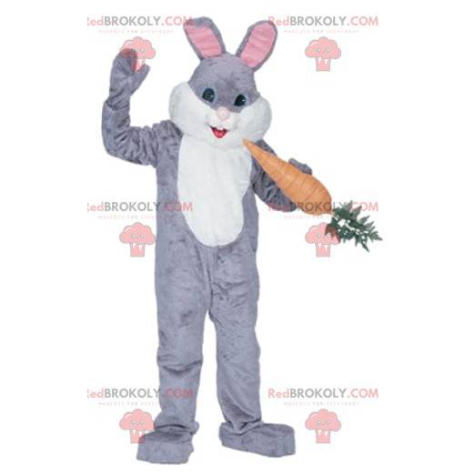 Gray and white rabbit mascot with a gourmet carrot -