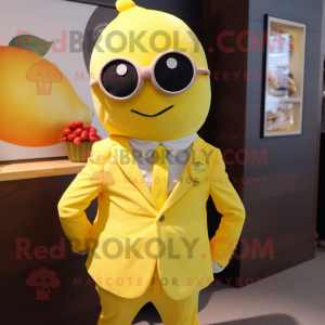 Lemon Yellow Raspberry mascot costume character dressed with a Cover-up and Ties