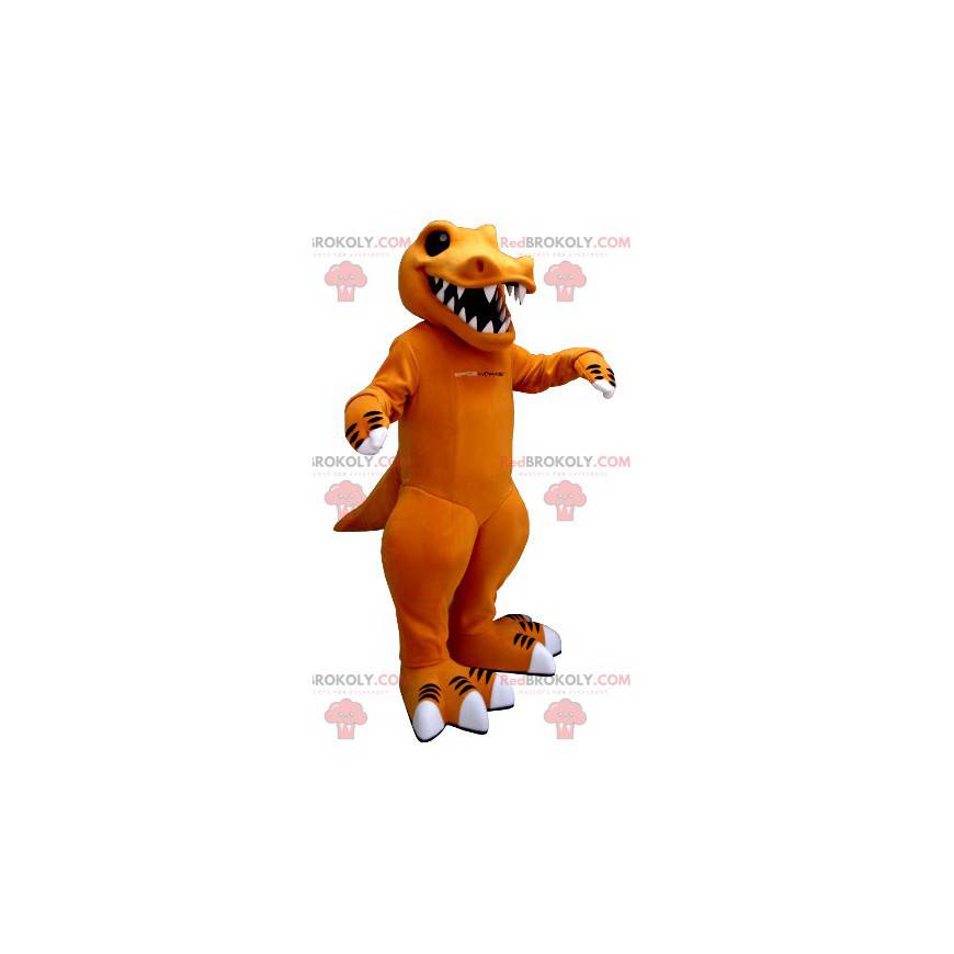 Mascota dinosaurio naranja y blanco con dientes grandes -