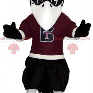 Mascotte d'aigle noir avec son maillot de supporter bordeaux -