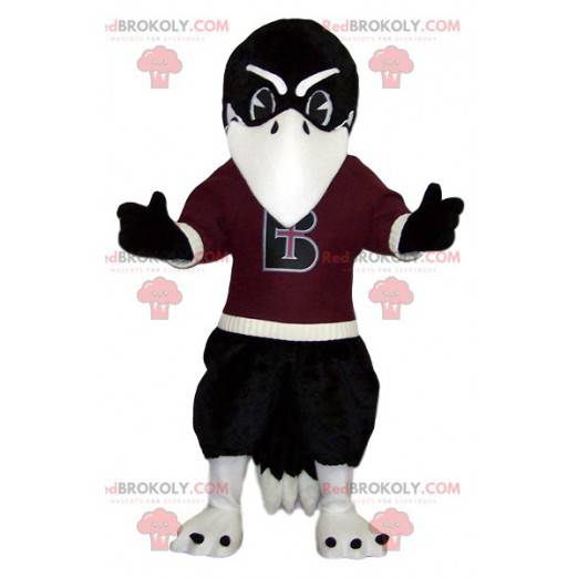 Mascote da águia negra com sua camisa de torcedor cor de vinho