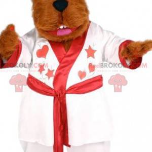 Mascote do urso vermelho macio com seu roupão branco -