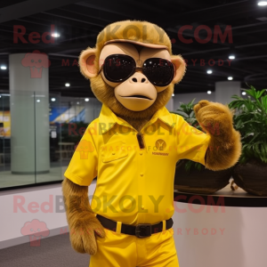 Gold Monkey mascot costume character dressed with a Polo Shirt and Sunglasses