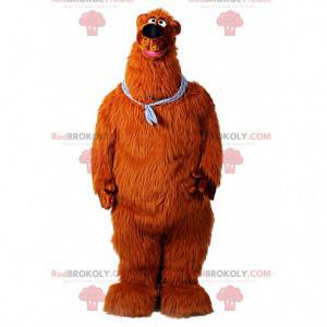 Giant brown bear mascot with a bandana around his neck -