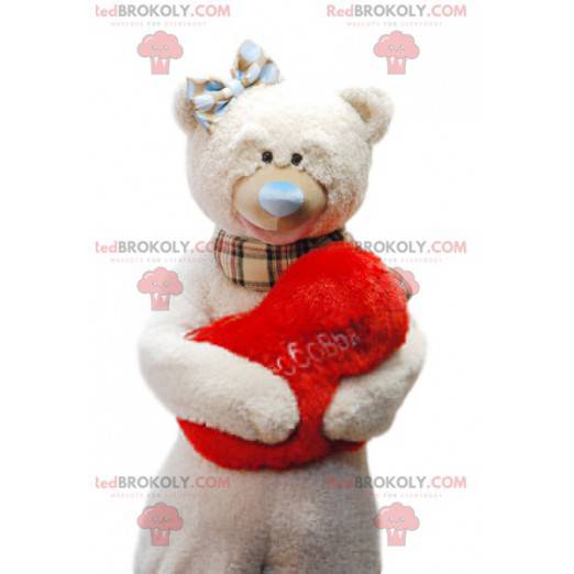 Mascote urso bege fofinho com sua almofada vermelha "Coração" -