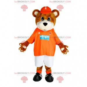 Brun björnmaskot med sin orange tröja som stöd - Redbrokoly.com