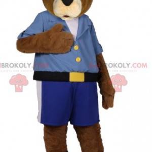 Bruine beer mascotte in blauwe korte broek en shirt -