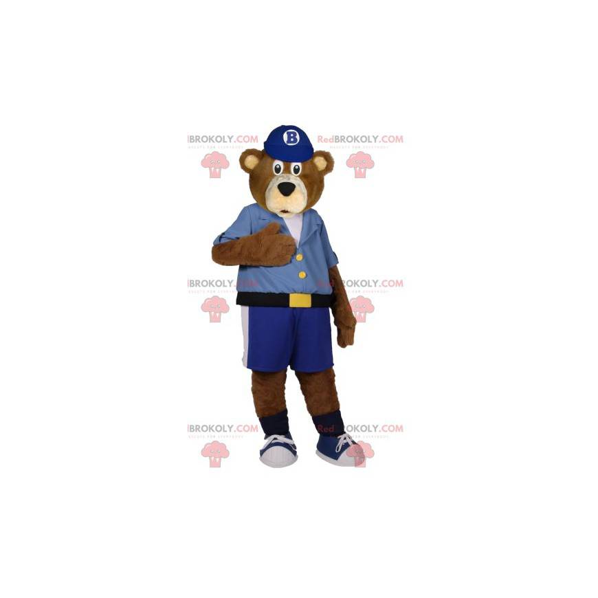 Mascota del oso pardo en pantalones cortos azules y camisa -