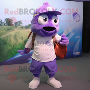 Purple Tuna mascot costume character dressed with a Polo Shirt and Messenger bags