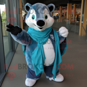 Turquoise Badger mascot costume character dressed with a Jeans and Shawl pins