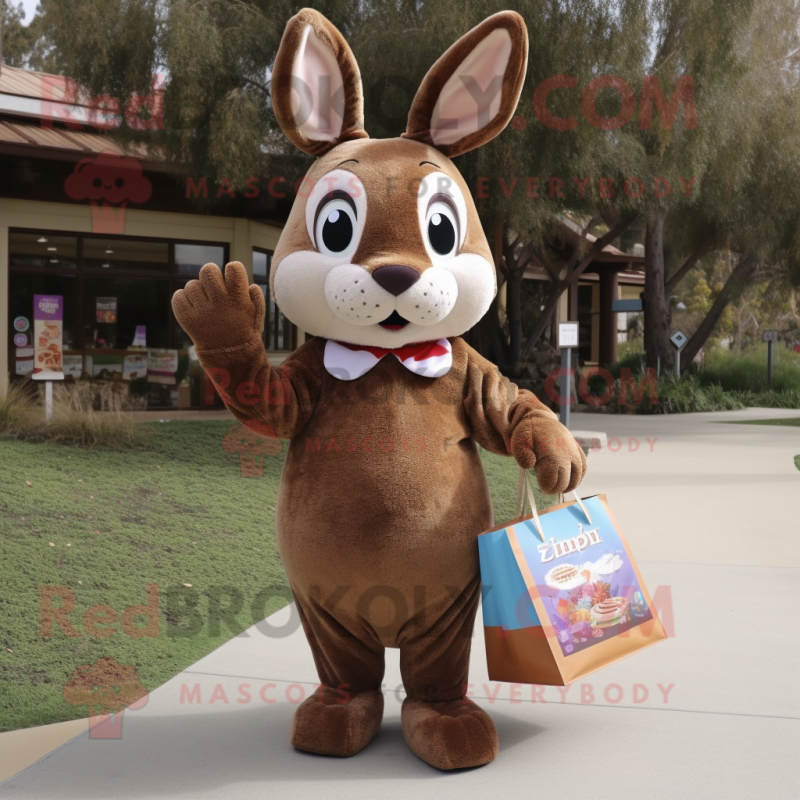 Brown Rabbit mascot costume character dressed with a Shift Dress and Tote bags Brown Rabbit mascot costume character dressed with a Shift Dress and Tote bags