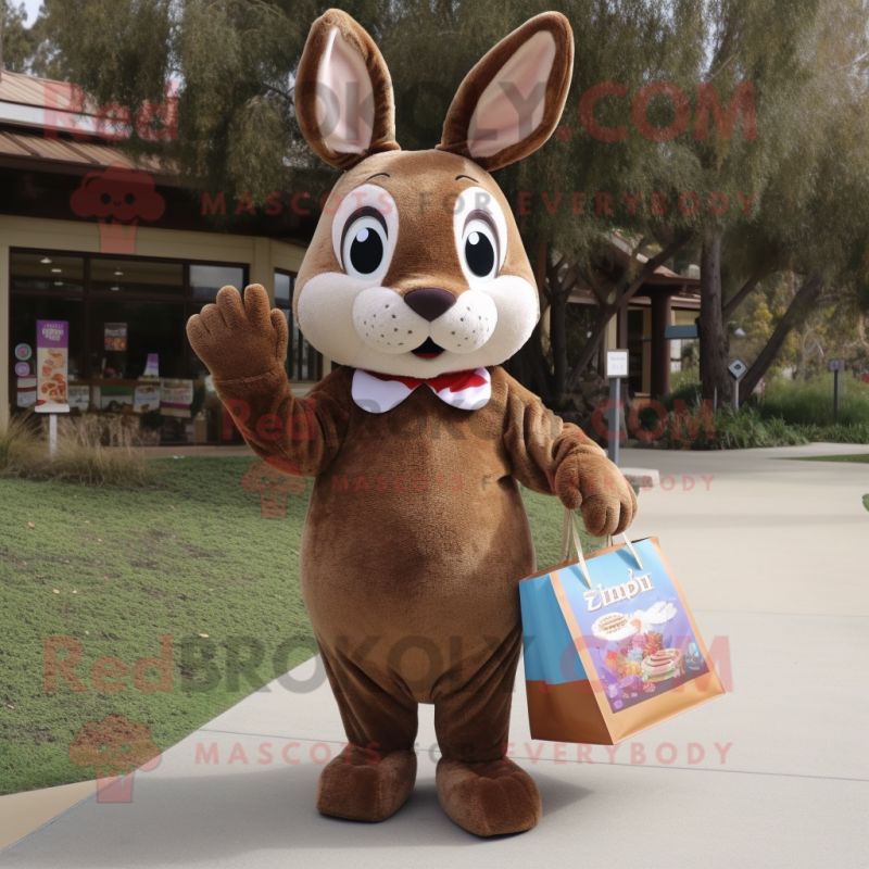 Brown Rabbit mascot costume character dressed with a Shift Dress and Tote bags