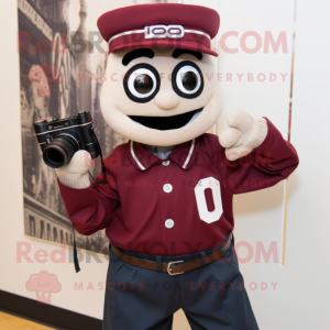 Maroon Camera mascot costume character dressed with a Oxford Shirt and Shawl pins