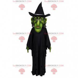 Mascote do mago verde com sua capa e chapéu preto -