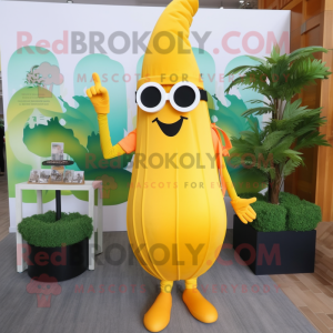 Yellow Carrot mascot costume character dressed with a Maxi Dress and Sunglasses