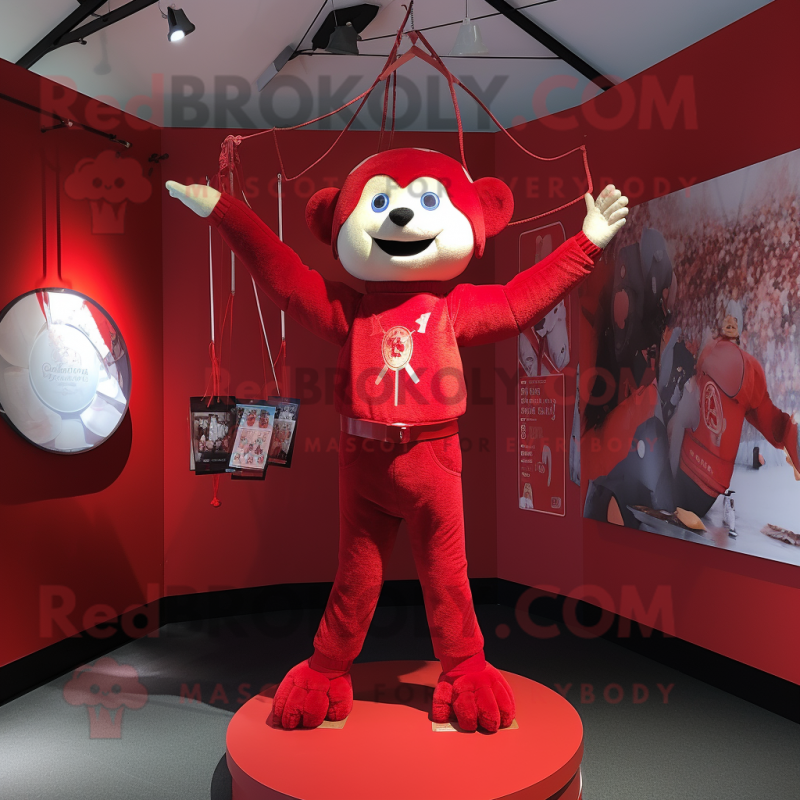 Red Trapeze Artist mascot costume character dressed with a V-Neck Tee and Cummerbunds Red Trapeze Artist mascot costume character dressed with a V-Neck Tee and Cummerbunds