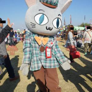 Giant gray rabbit mascot dressed in Scottish attire -