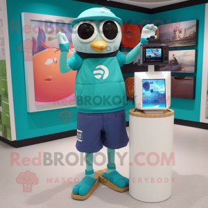 Teal Camera mascot costume character dressed with a Board Shorts and Digital watches