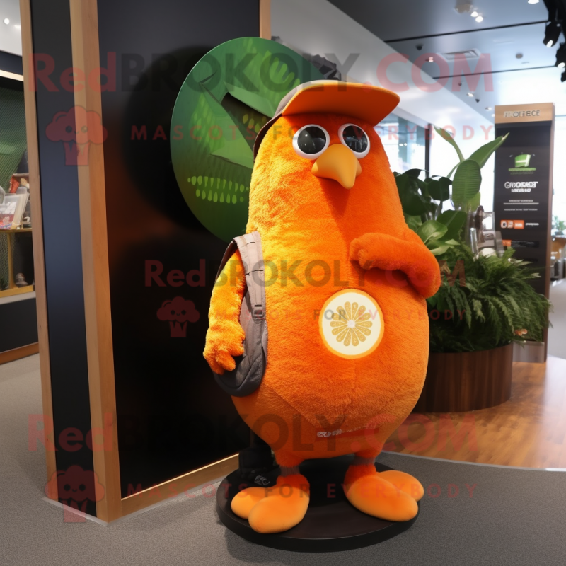 Orange Kiwi mascot costume character dressed with a Cover-up and Backpacks