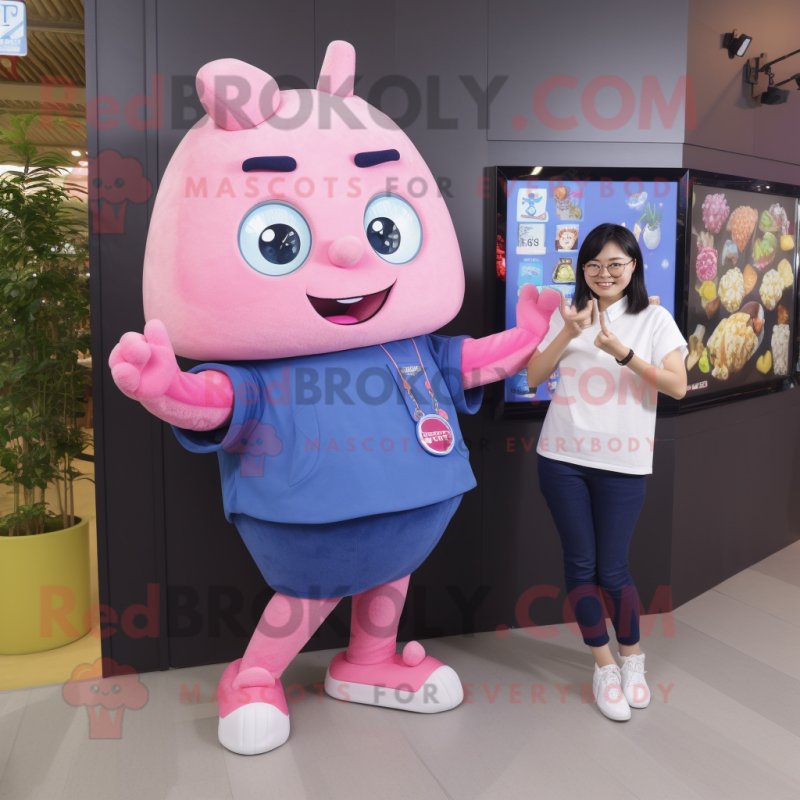 Pink Dim Sum mascot costume character dressed with a Denim Shirt and Smartwatches Pink Dim Sum mascot costume character dressed with a Denim Shirt and Smartwatches