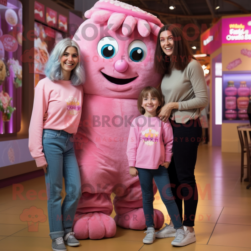 Pink Chocolates mascot costume character dressed with a Mom Jeans and Hair clips Pink Chocolates mascot costume character dressed with a Mom Jeans and Hair clips