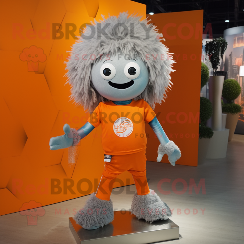 Silver Orange mascot costume character dressed with a Romper and Hair clips