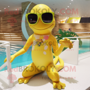 Gold Lizard mascot costume character dressed with a Swimwear and Sunglasses