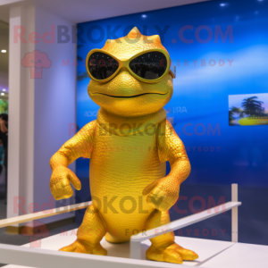Gold Lizard mascot costume character dressed with a Swimwear and Sunglasses